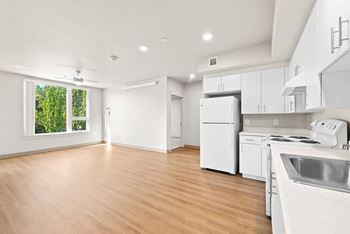 Modern kitchen view with white appliances